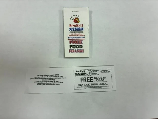 The Rocky’s Pizzeria Lindenhurst Free Food for a Year coupon book and a free slice of pizza coupon valid June 22–28, 2014.