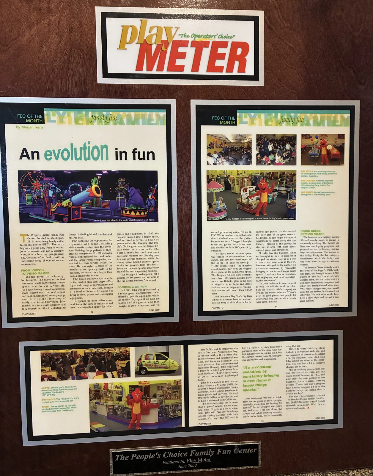 A framed June 2009 Play Meter display with three People’s Choice Family Fun Center feature pages and a recognition plaque.